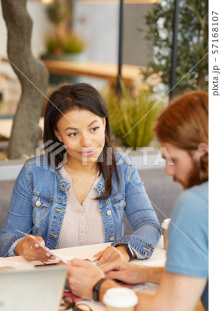 People doing paper work People doing paper work 57168107