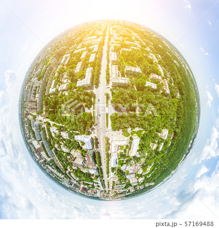 Aerial city view with crossroads and roads, houses, buildings, parks and parking lots. Sunny summer 57169488