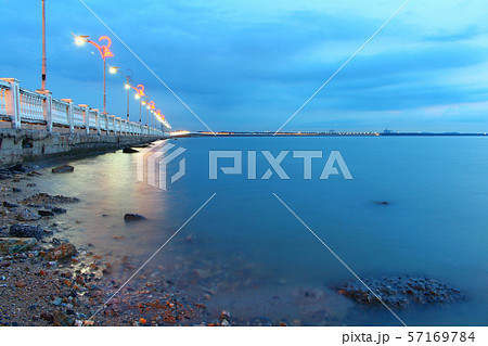 Seascape at sunset twilight On the beach rocks Along the bridge Viewpoint 57169784