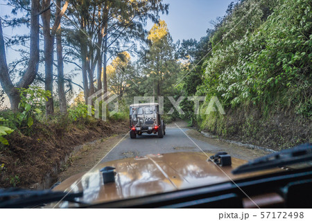 View from the inside of an offroad car riding down the road at the Bromo Tengger Semeru National 57172498