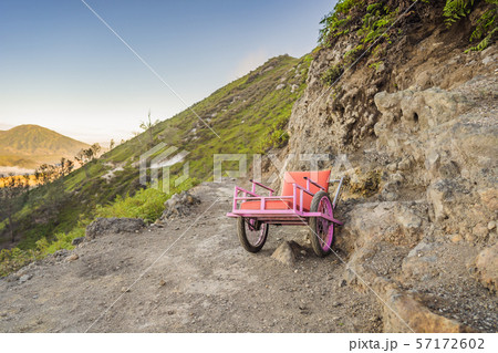On a mountain road trecking to the Ijen volcano or Kawah Ijen on the Indonesian language. Famous On a mountain road trecking to the Ijen volcano or Kawah Ijen on the Indonesian language. Famous 57172602