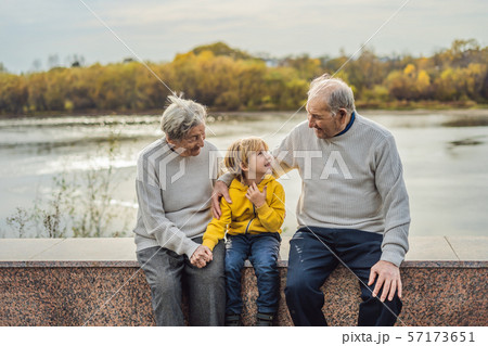 Senior couple with baby grandson in the autumn park. Great-grandmother, great-grandfather and great 57173651