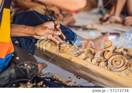 Master wood-carver made using a special knife wooden national dish - a ladle with a patterned handle Master wood-carver made using a special knife wooden national dish - a ladle with a patterned handle 57173738