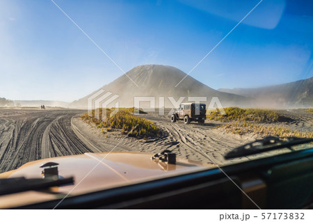 View from inside of an offroad car riding through the so-called Sea of sand inside the Tengger View from inside of an offroad car riding through the so-called Sea of sand inside the Tengger 57173832