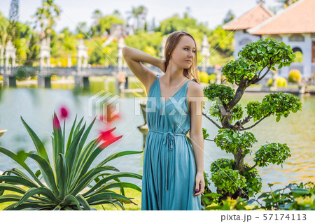 Young woman in dress in Water Palace Soekasada Taman Ujung Ruins on Bali Island in Indonesia Young woman in dress in Water Palace Soekasada Taman Ujung Ruins on Bali Island in Indonesia 57174113