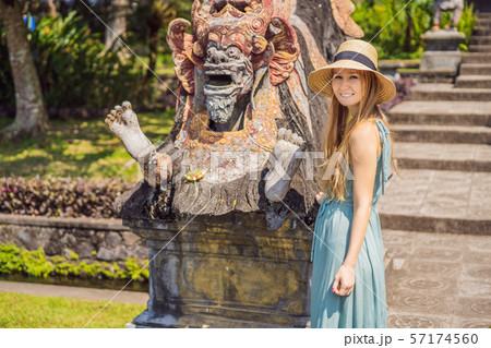 Young woman tourist in Taman Tirtagangga, Water palace, Water park, Bali Indonesia 57174560