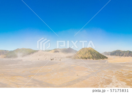 Panoramic Aerial shot of the Bromo volcano and Batok volcano at the Bromo Tengger Semeru National Panoramic Aerial shot of the Bromo volcano and Batok volcano at the Bromo Tengger Semeru National 57175831