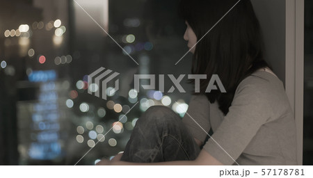 woman feel depressed by window woman feel depressed by window 57178781