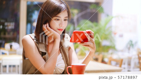 woman watch video by cellular 57178897