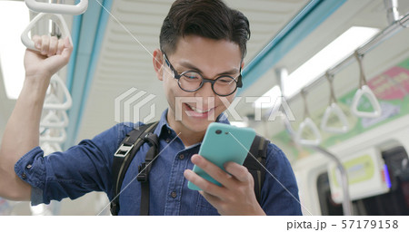 man use phone in MRT man use phone in MRT 57179158