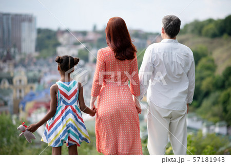 Family standing and enjoying amazing city view while walking Family standing and enjoying amazing city view while walking 57181943
