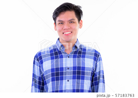 Face of happy young handsome Asian hipster man smiling 57183763