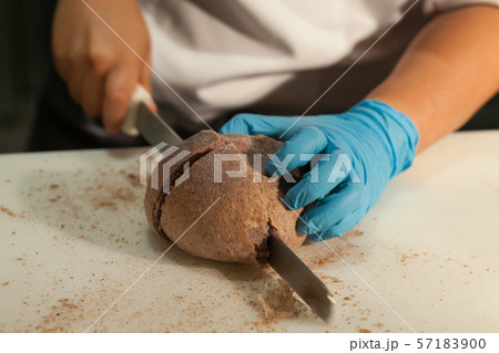 Blurry background of the chef is cutting the bread 57183900