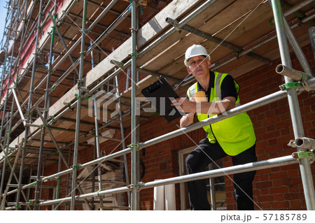 Construction Foreman Builder on Building Site 57185789