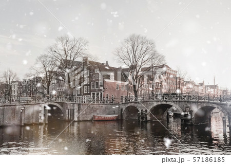 Amsterdam dull view in winter snowfall 57186185