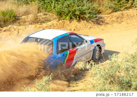 Sports Car on a Bend and a lot of Dust 04 57186217