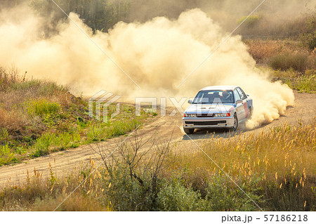 Sports Car on a Bend and a lot of Dust 03 57186218