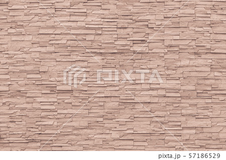 Rock stone brick tile wall aged texture detailed pattern background in cream red brown color 57186529