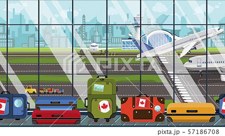 Suitcases with Canada flag stickers on baggage carousel in airport. Canadian tourism related 57186708