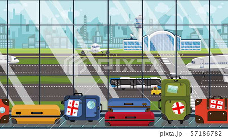 Suitcases with Georgian flag stickers on baggage carousel in airport. Tourism in Georgia conceptual 57186782