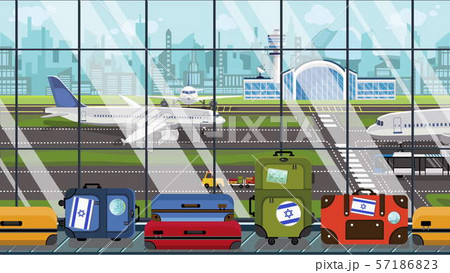 Suitcases with Israel flag stickers on baggage carousel in airport. Israeli tourism related 57186823