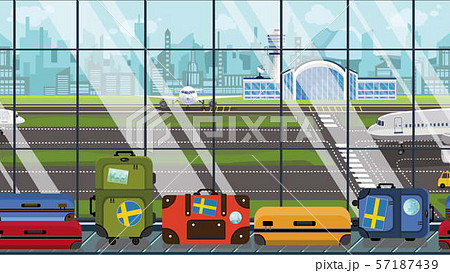 Suitcases with Sweden flag stickers on baggage carousel in airport. Swedish tourism conceptual 57187439