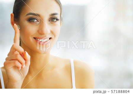 Vision Contact Lenses. Closeup With Beautiful Woman Face 57188804