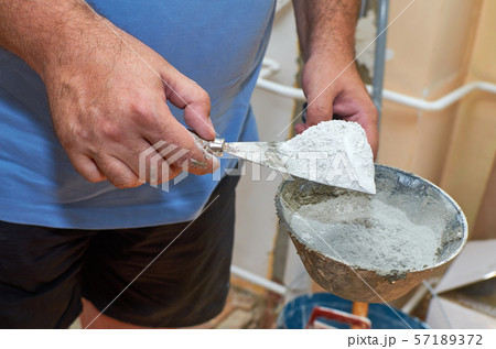 Scraper and plasterer's scoop with gypsum powder Scraper and plasterer's scoop with gypsum powder 57189372