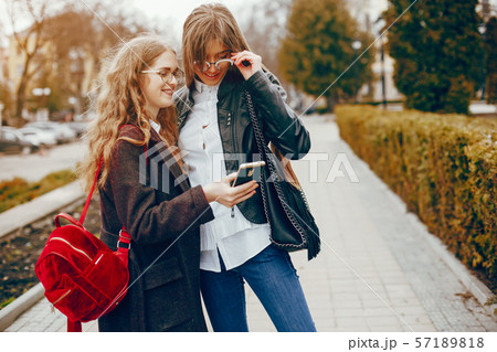 two stylish girl in a city two stylish girl in a city 57189818