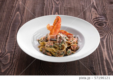 Pasta with chicken, oyster mushrooms and bacon 57196121