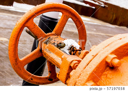 big orange iron valve old weathered flaky big orange iron valve old weathered flaky 57197038