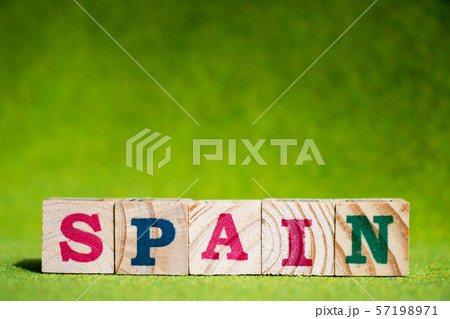 Letter block in word spain on artificial green grass 57198971
