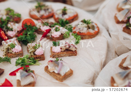 Delicious sandwiches with herring and onion.Close 57202674