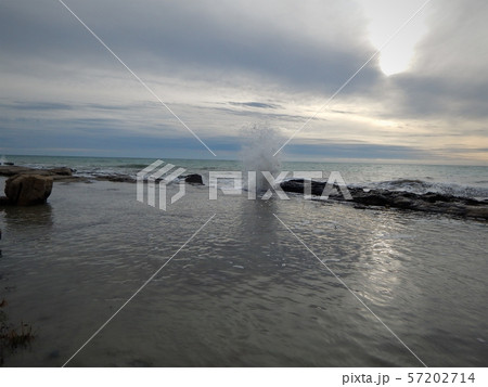 Wave breaks on the rocks. Wave breaks on the rocks. 57202714