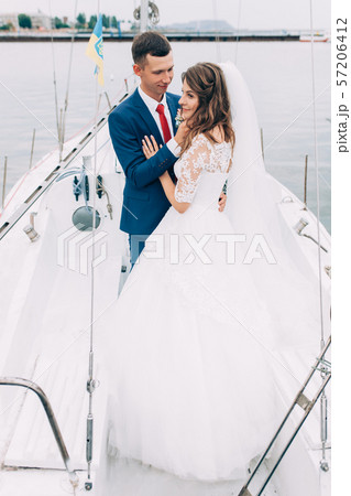 Wedding couple on the yacht, lovers posing on the Wedding couple on the yacht, lovers posing on the 57206412