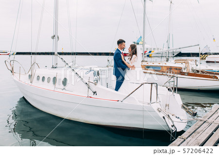 Wedding couple on the yacht, lovers posing on the Wedding couple on the yacht, lovers posing on the 57206422