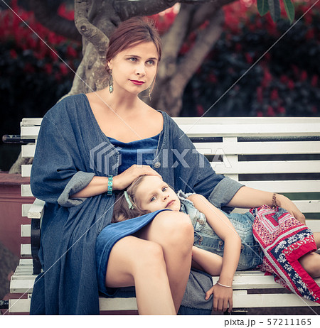Mother and daughter in a park Mother and daughter in a park 57211165