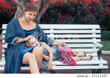 Mother and daughter in a park Mother and daughter in a park 57211167
