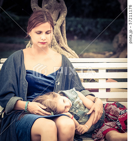 Mother and daughter in a park Mother and daughter in a park 57211176