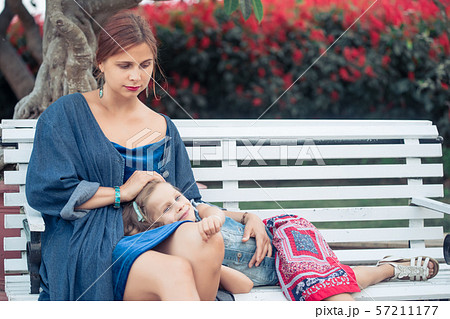 Mother and daughter in a park Mother and daughter in a park 57211177