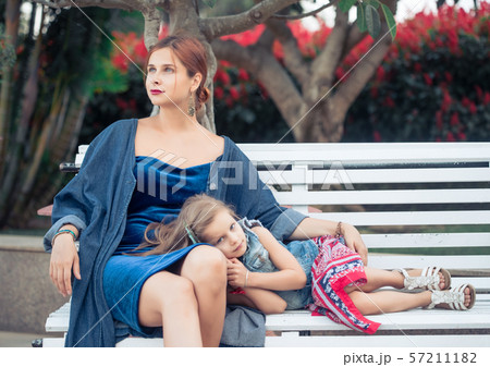 Mother and daughter in a park Mother and daughter in a park 57211182