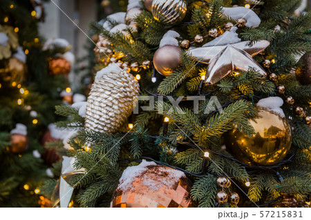 Christmas tree closeup. Golden star, balls and 57215831