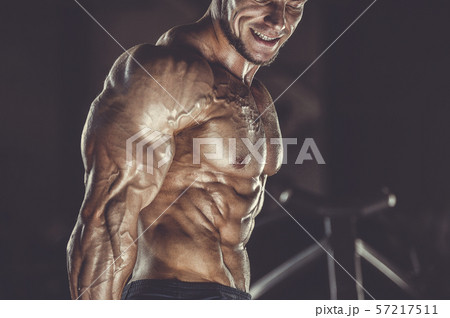 Brutal strong men workout bodybuilding background - muscular bodybuilder men doing exercises in gym Brutal strong men workout bodybuilding background - muscular bodybuilder men doing exercises in gym 57217511