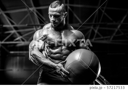 Brutal strong men workout bodybuilding background - muscular bodybuilder men doing exercises in gym Brutal strong men workout bodybuilding background - muscular bodybuilder men doing exercises in gym 57217533
