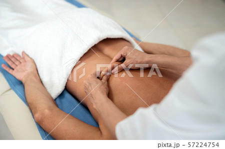 Female doctor doing lumbar massage in hospital 57224754
