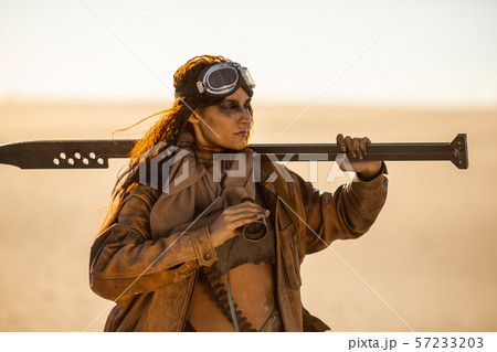 Post-apocalyptic Woman Outdoors in a Wasteland Post-apocalyptic Woman Outdoors in a Wasteland 57233203