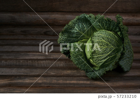 Savoy cabbage on a rustic wooden background Savoy cabbage on a rustic wooden background 57233210
