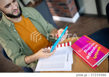 Student listening to recording while studying language Student listening to recording while studying language 57235066