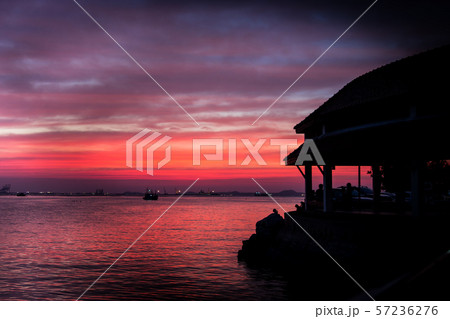 Cloudy orange and sea tropical sunset Cloudy orange and sea tropical sunset 57236276