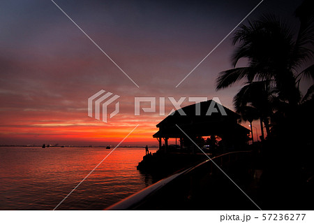 Cloudy orange and sea tropical sunset Cloudy orange and sea tropical sunset 57236277